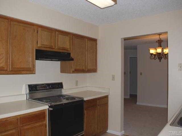 106 Choptank Court Cary, NC 27513 - Photo 5 of 12 a kitchen with a sink and cabinets