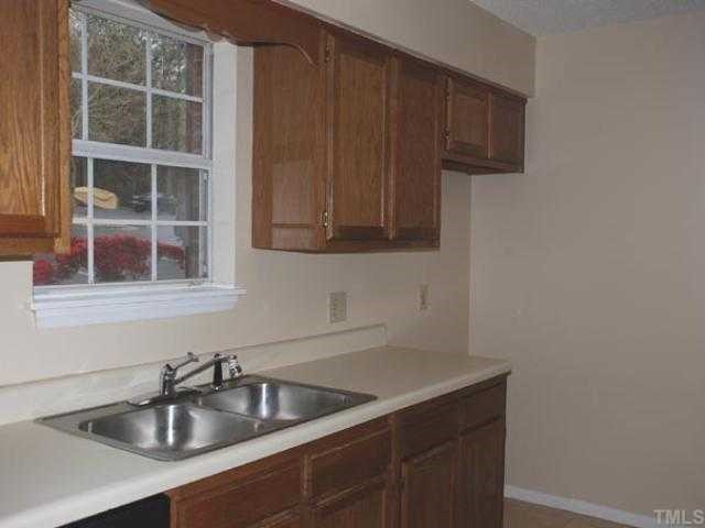 106 Choptank Court Cary, NC 27513 - Photo 6 of 12 a kitchen with a sink and cabinets