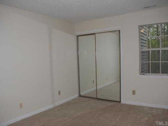 106 Choptank Court Cary, NC 27513 - Photo 7 of 12 an empty room with windows