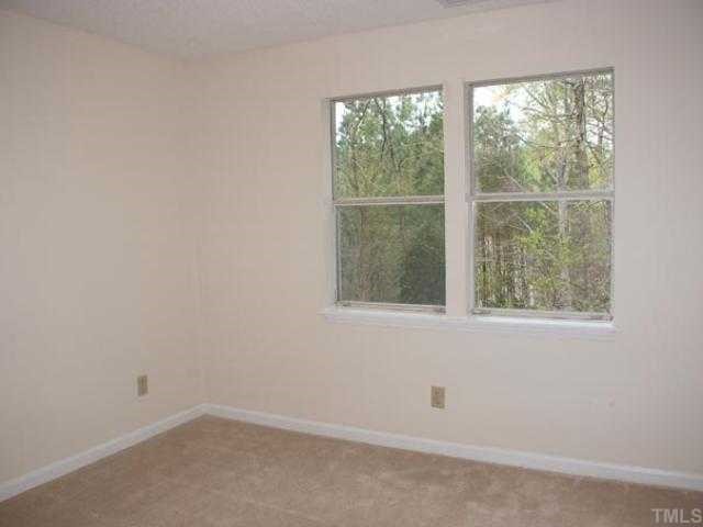 106 Choptank Court Cary, NC 27513 - Photo 8 of 12 an empty room with a window