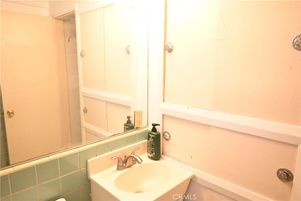 1037 North Valley Street Burbank, CA 91505 - Photo 11 of 27 a bathroom with a sink and a mirror