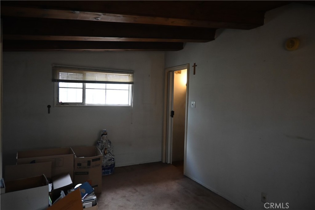 1037 North Valley Street Burbank, CA 91505 - Photo 14 of 27 a room with a chair and a window