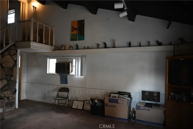 a utility room with multiple dryer and washer