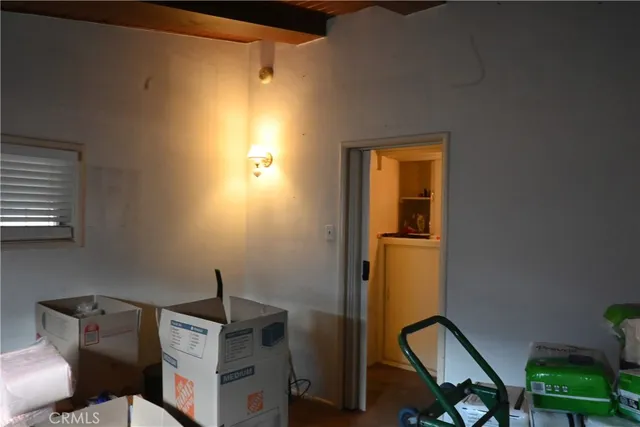 a view of workspace with wooden floor windows