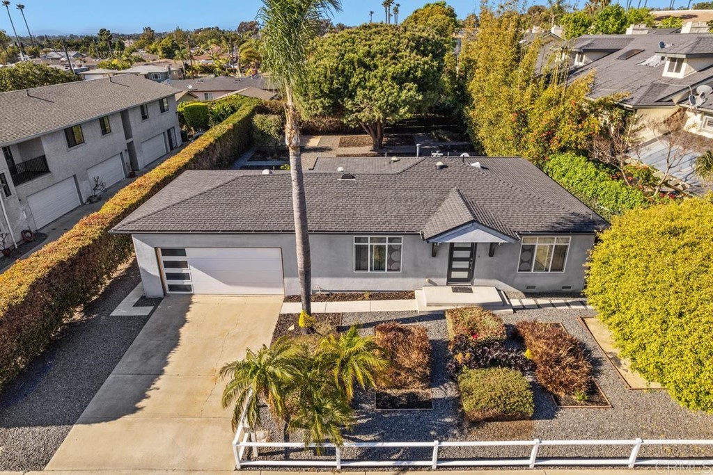 a view of a house with wooden fence