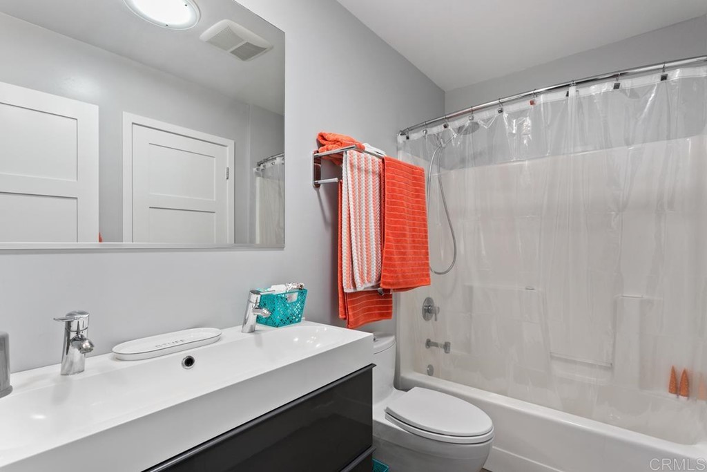 990 Laguna Drive Carlsbad, CA 92008 - Photo 12 of 21 a bathroom with a sink toilet and shower