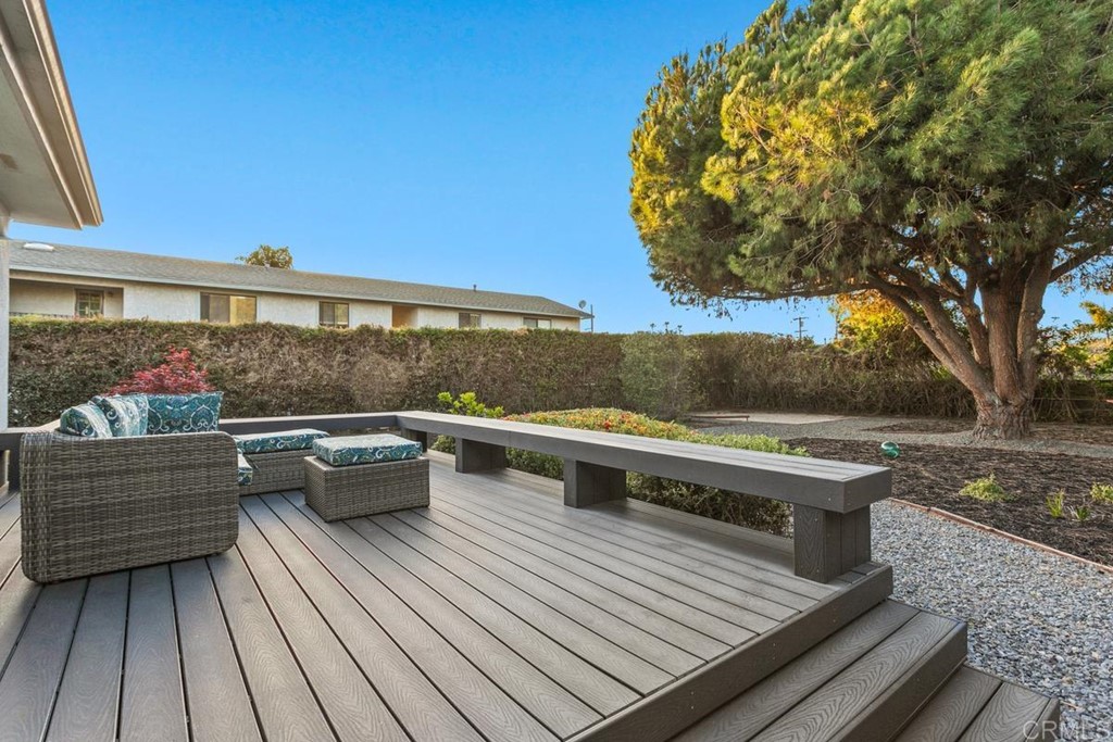 990 Laguna Drive Carlsbad, CA 92008 - Photo 14 of 21 a view of balcony with wooden floor and outdoor seating
