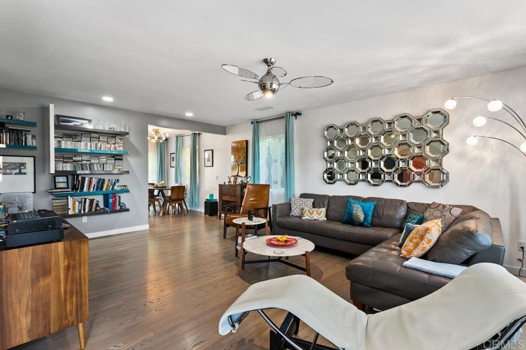990 Laguna Drive Carlsbad, CA 92008 - Photo 3 of 21 a living room with furniture and wooden floor