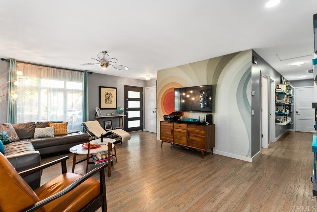 990 Laguna Drive Carlsbad, CA 92008 - Photo 4 of 21 a living room with furniture and wooden floor