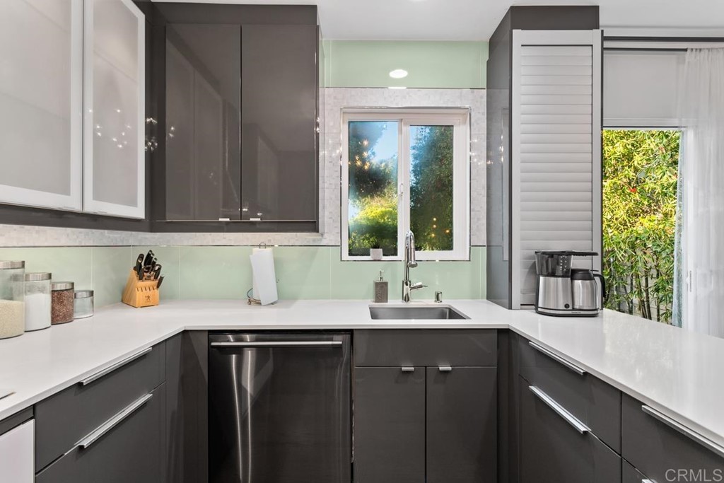 990 Laguna Drive Carlsbad, CA 92008 - Photo 7 of 21 a kitchen with a sink and cabinets