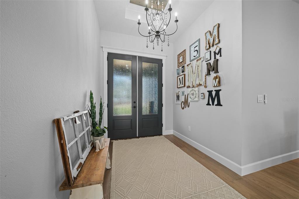 11707 Southeast 101st Court Road Belleview, FL 34420 - Photo 14 of 84 a view of a hallway with front door
