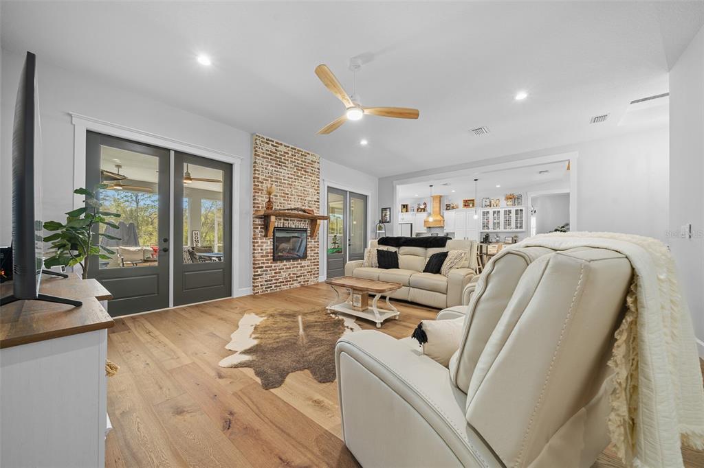 11707 Southeast 101st Court Road Belleview, FL 34420 - Photo 18 of 84 a living room with furniture and a large window