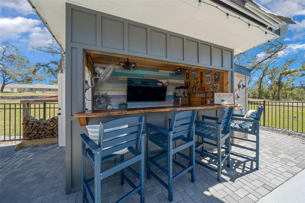 11707 Southeast 101st Court Road Belleview, FL 34420 - Photo 59 of 84 a view of a dining room with furniture and wooden floor