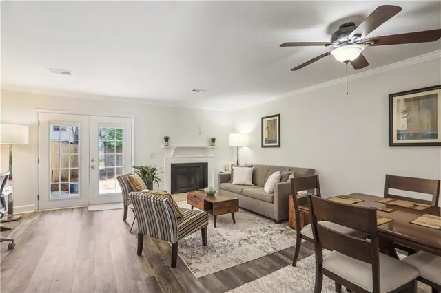 a living room with furniture fireplace and a table