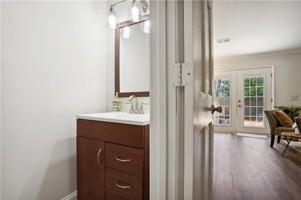 a en suite bathroom with a sink a mirror and a bathtub