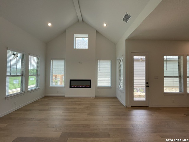 9431 Hidden Stone Schertz, TX 78154 - Photo 6 of 30 an empty room with wooden floor and windows