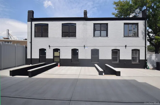 a front view of building with yard