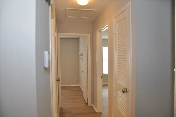 a view of a bathroom from the hallway