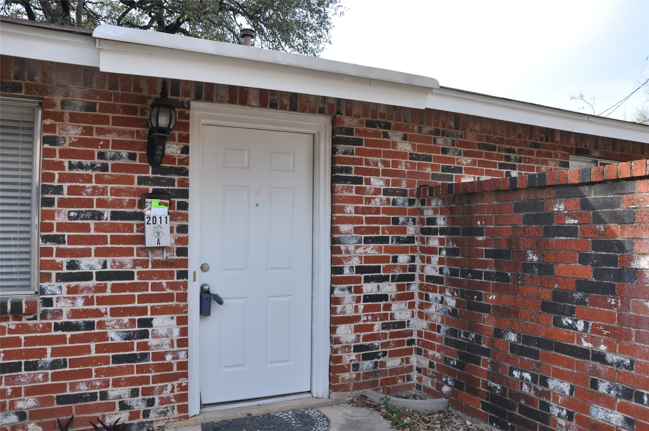2011 Gathright Cove, Unit A Austin, TX 78704 - Photo 3 of 17 a front view of a building with a street