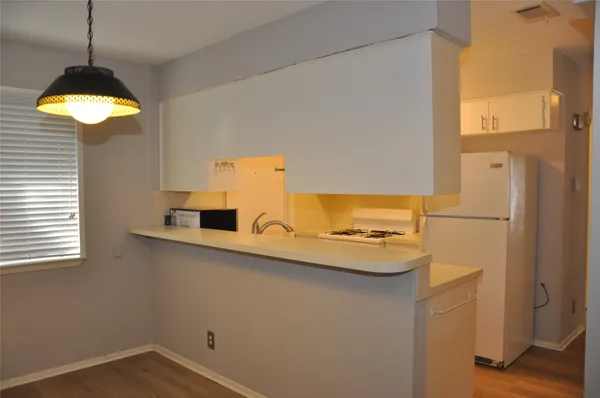 a kitchen with a sink and a stove