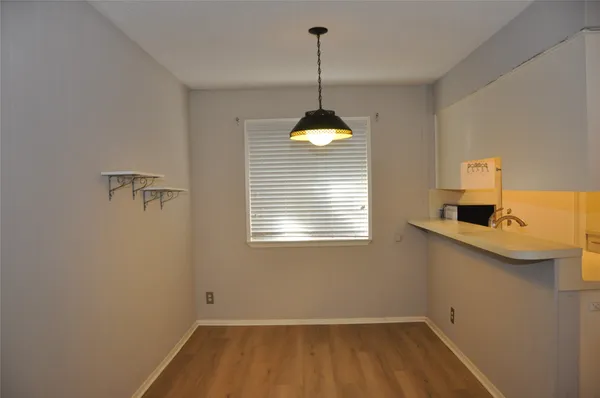 a bathroom with a sink and a window