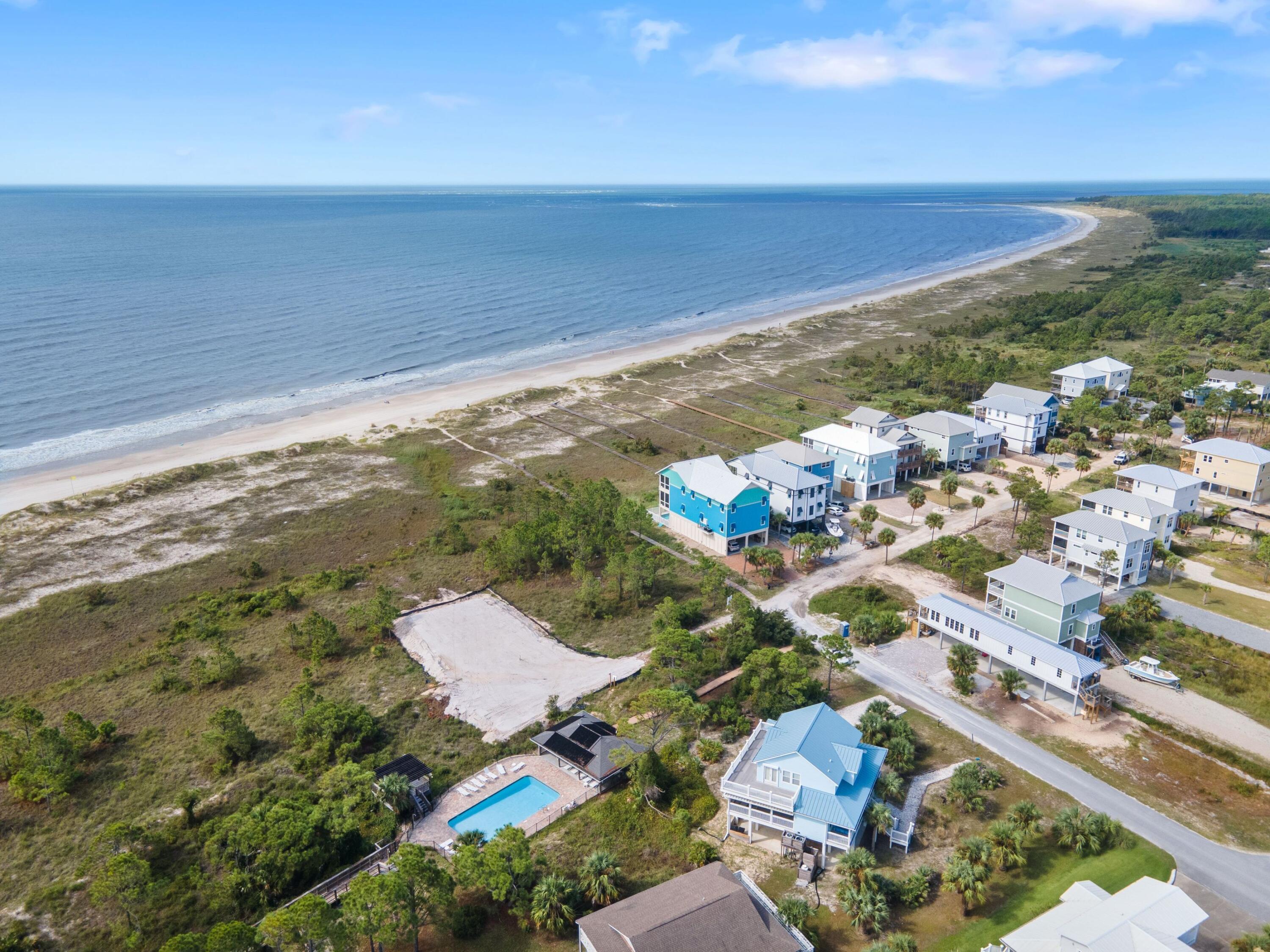 292 Pebble Beach Avenue Port St. Joe, FL 32456 - Photo 17 of 23 an aerial view of ocean and residential houses with outdoor space