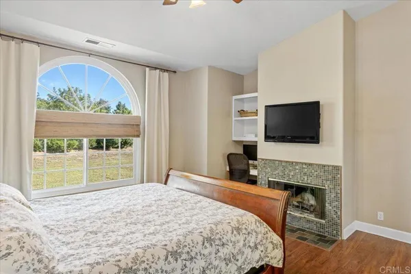 a bedroom with a large bed and a dresser