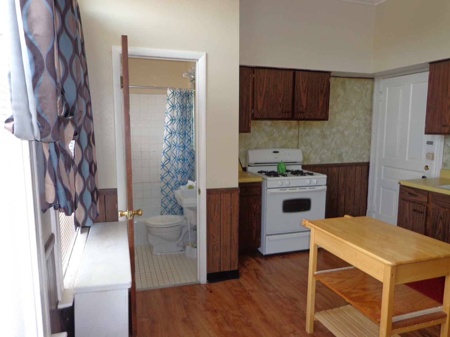 2357 Walnut Street, Unit 3 Blue Island, IL 60406 - Photo 13 of 16 a kitchen with a stove a sink and a refrigerator