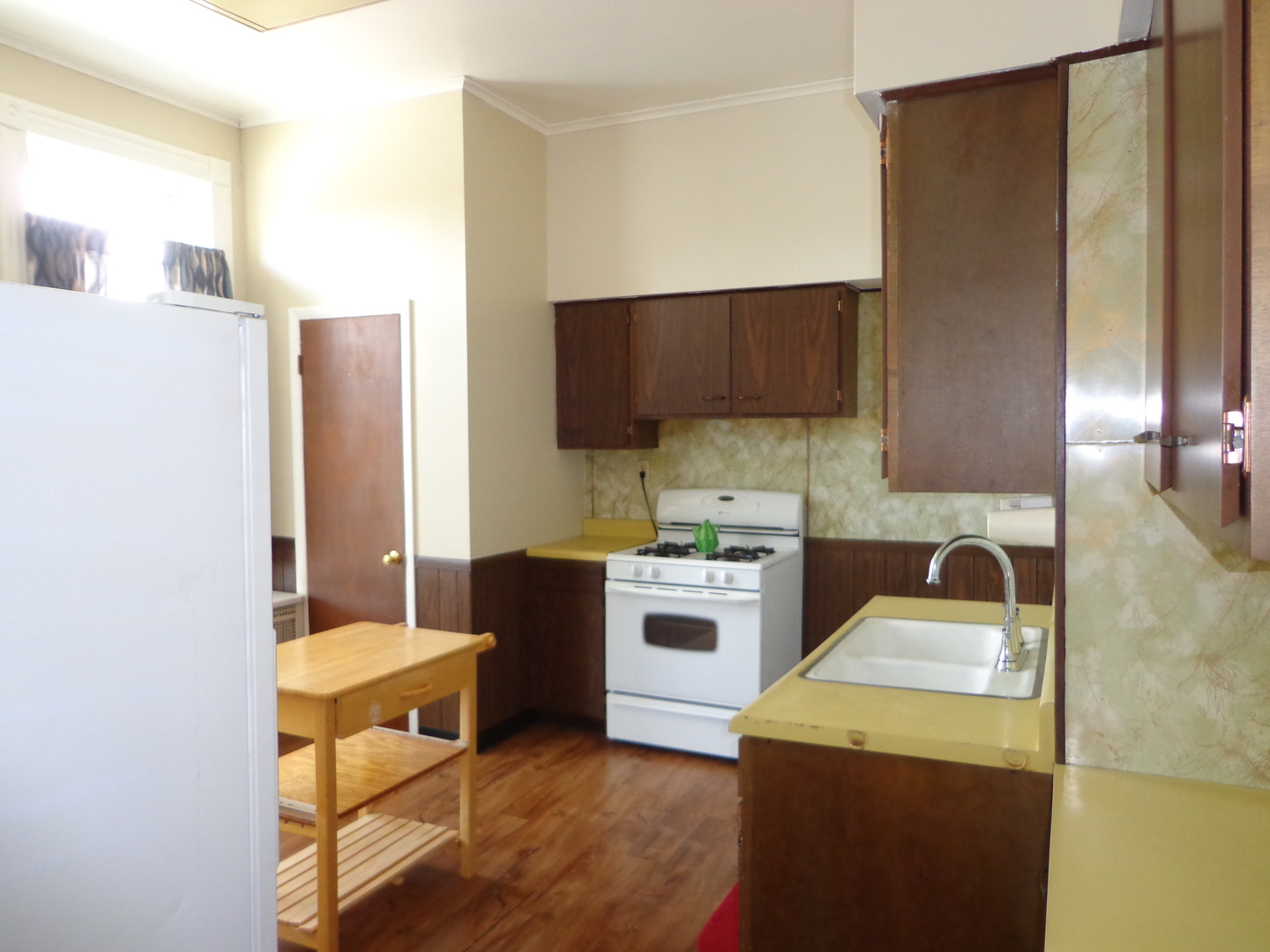 2357 Walnut Street, Unit 3 Blue Island, IL 60406 - Photo 9 of 16 a kitchen with a sink cabinets and wooden floor