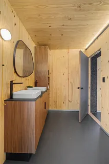 a bathroom with a double vanity sink and a mirror