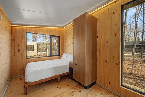 a bedroom with a bed and a window