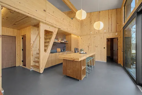 a spacious bathroom with a double vanity sink and a mirror