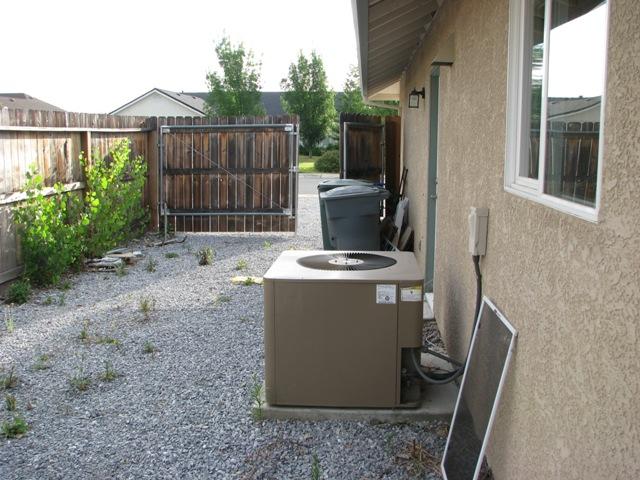 7550 Pit Road Redding, CA 96001 - Photo 14 of 20 a view of backyard with barbeque grill and wooden fence