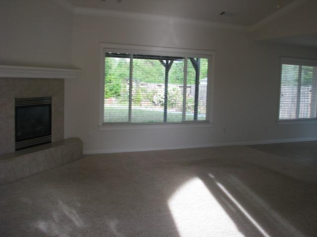 7550 Pit Road Redding, CA 96001 - Photo 5 of 20 an empty room with a fireplace