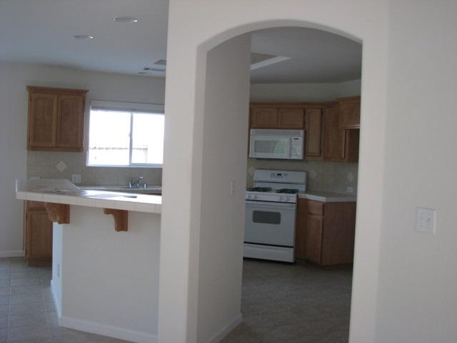 7550 Pit Road Redding, CA 96001 - Photo 6 of 20 a kitchen with a sink cabinets and window
