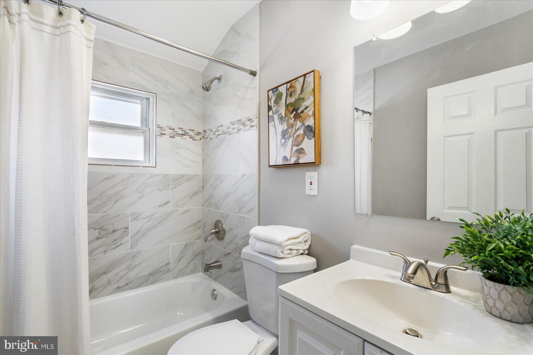 1932 Haselmere Road Dundalk, MD 21222 - Photo 22 of 40 a bathroom with a sink toilet and shower