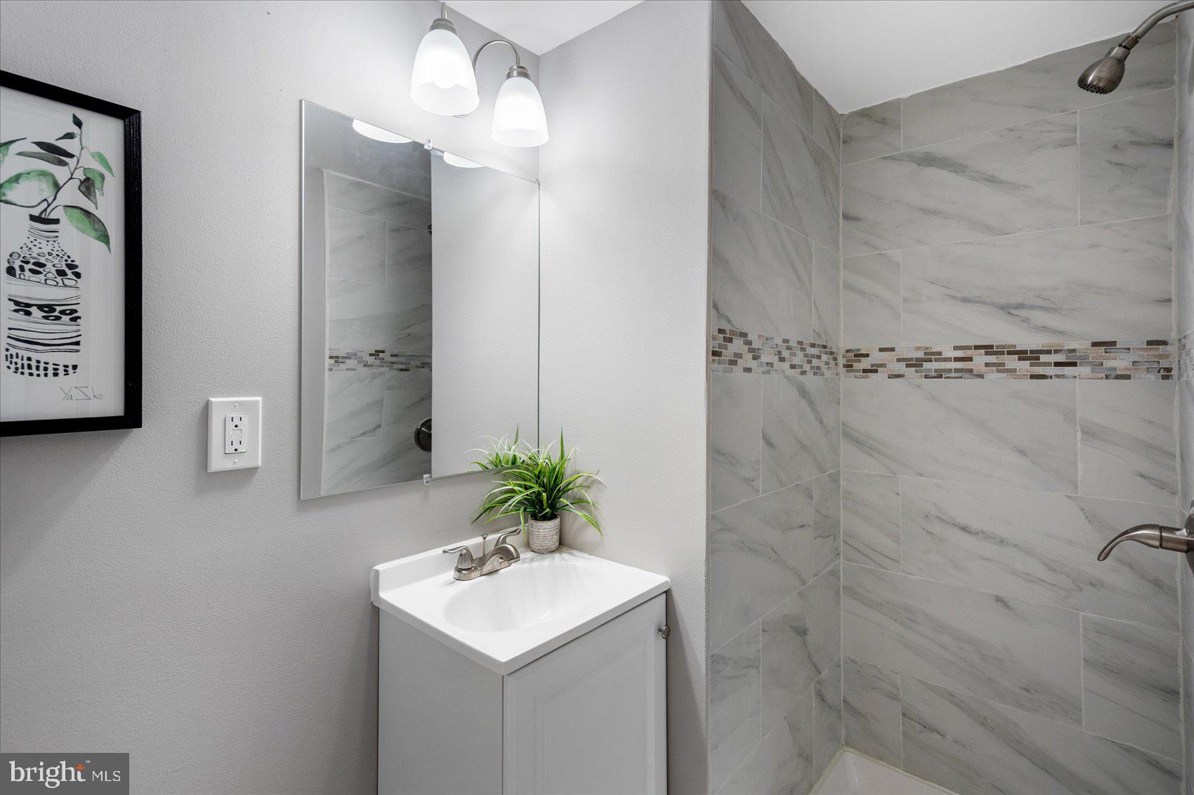 1932 Haselmere Road Dundalk, MD 21222 - Photo 29 of 40 a bathroom with a sink a toilet and shower