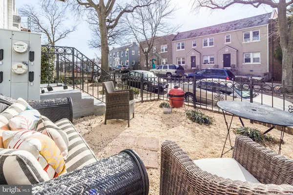 a view of a dinning tables and chairs in a patio
