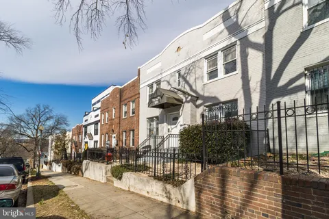 a view of a building with a snow on the road