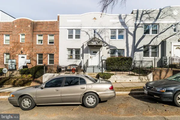 a car parked in front of a house