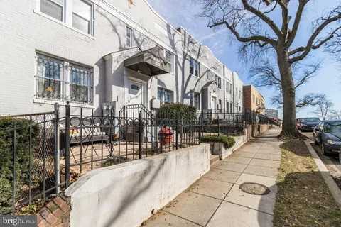 a view of tall buildings with the trees