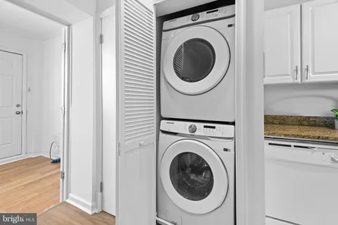 a view of a hallway with washer and dryer