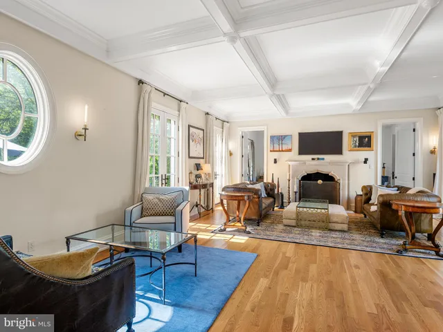 a kitchen with a sink stove and chairs