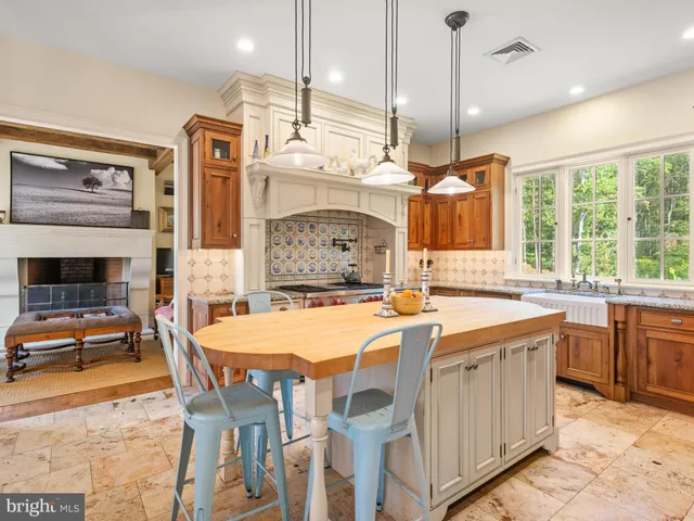 a white bath tub sitting in a bathroom next to a window