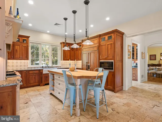 a bathroom with a sink mirror toilet and shower