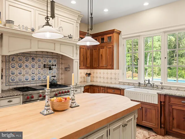 a bathroom with a toilet a sink and a mirror