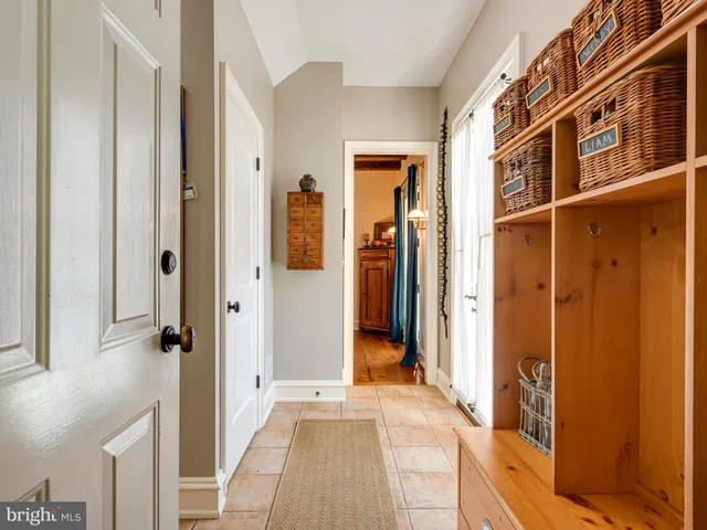 a view of a patio with table and chairs and potted plants