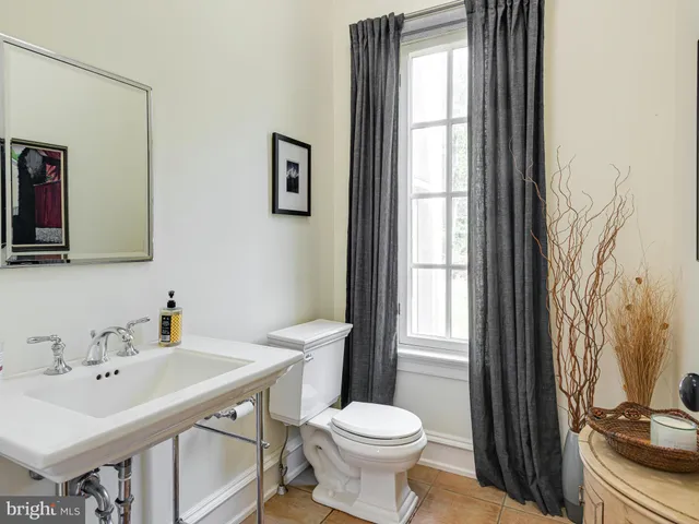 a front view of a house with a big yard