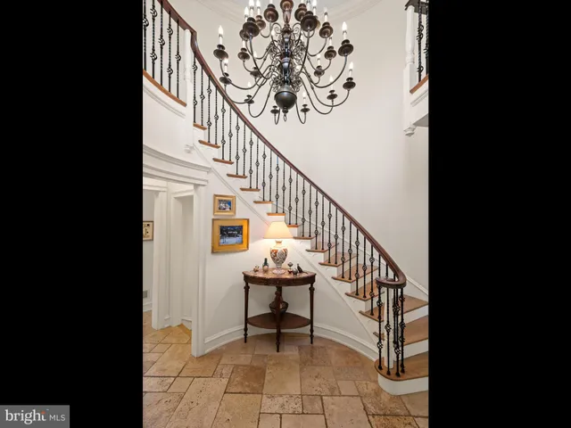 a living room with fireplace furniture and a wooden floor
