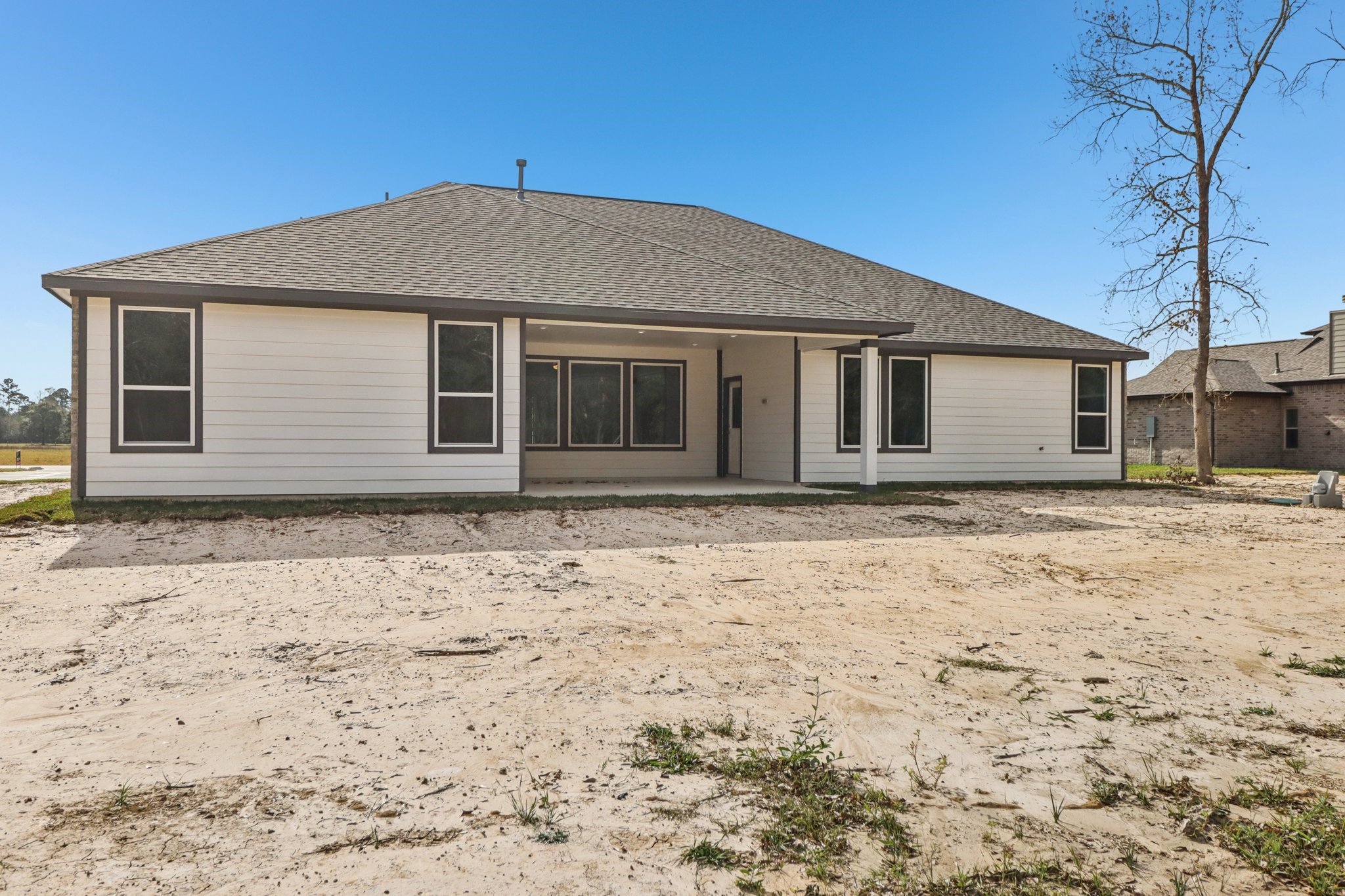 13424 Maverick Trail Road Conroe, TX 77303 - Photo 34 of 35 a front view of a house with a yard